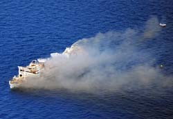 Port bow aerial view of the smokey Gen. Hoyt S. Vandenberg