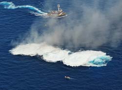 Only the radar dish remains above the blue ocean of the artificial reef Vandenberg