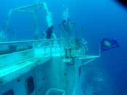 Two divers with Conch Republic flag on the Vandenberg wreck in Key West